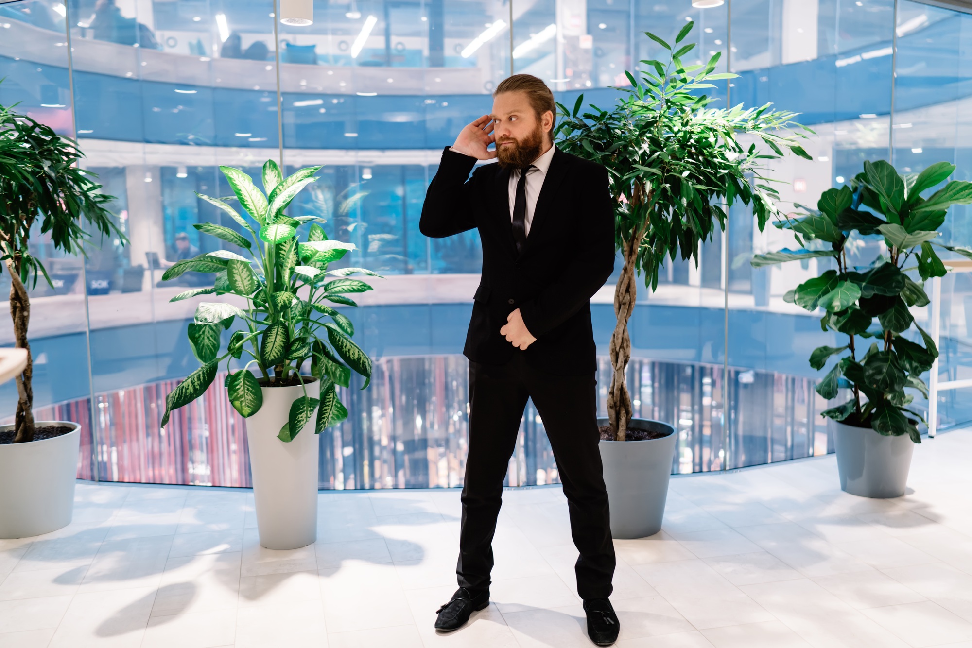 Confident security guard standing in business center